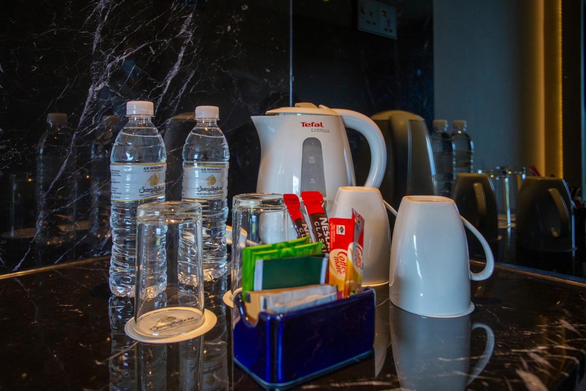 The Pacific Sutera Hotel Kota Kinabalu Kültér fotó Bottled water in a hotel room
